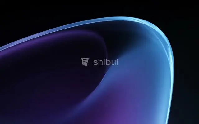 Uma curva suave de cor azul e roxa em um fundo escuro e abstrato.