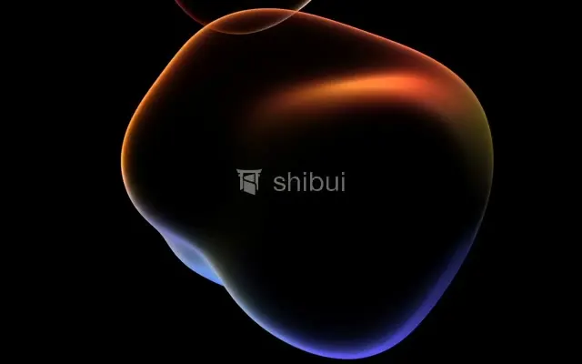 Uma forma abstrata com brilhos laranja e azul sobre um fundo preto.