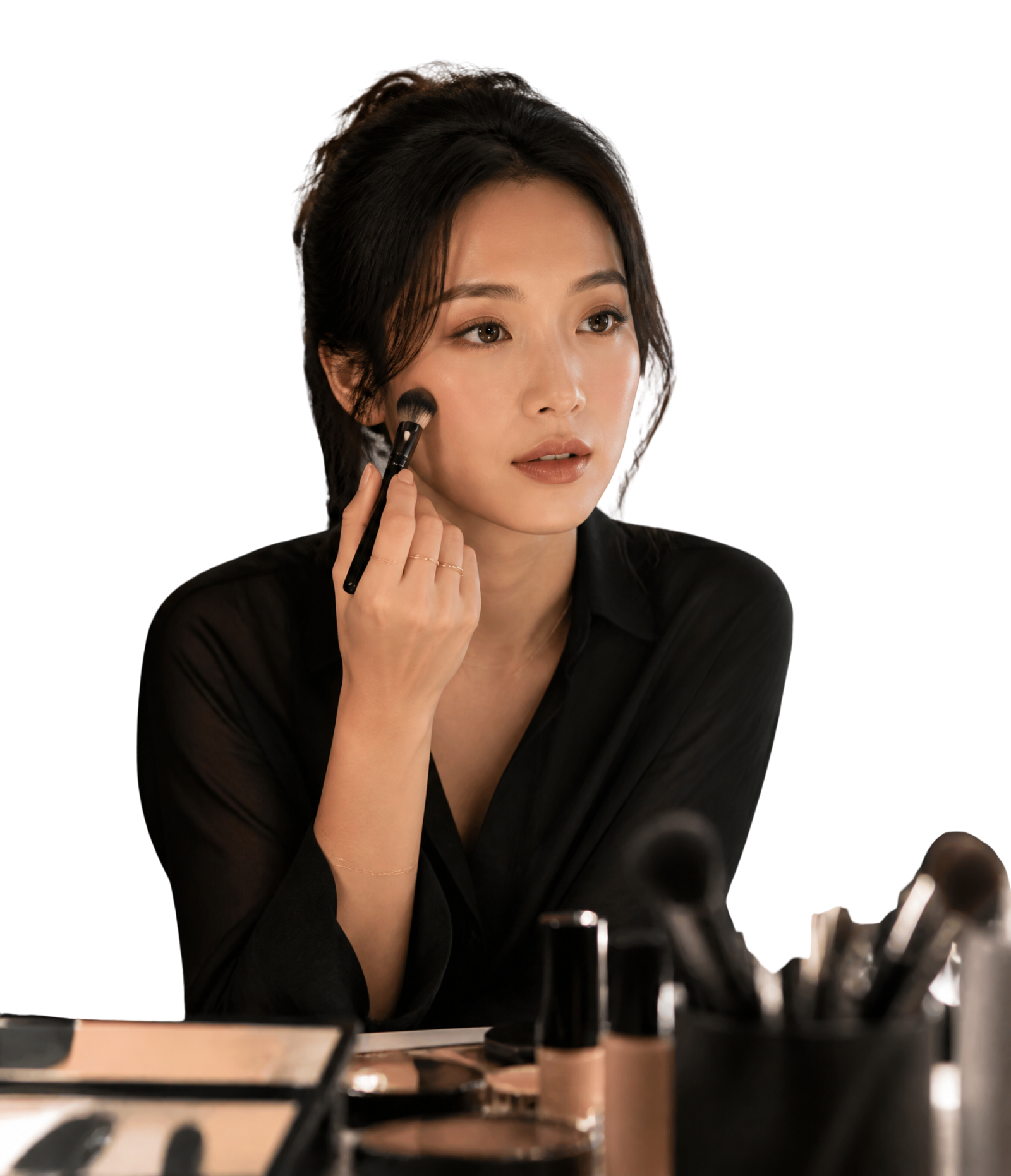 Amara applying makeup on set