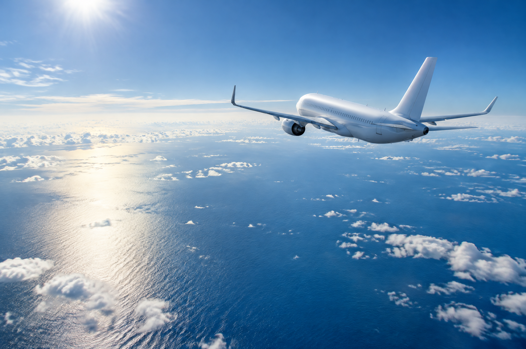 High-altitude aircraft over open ocean