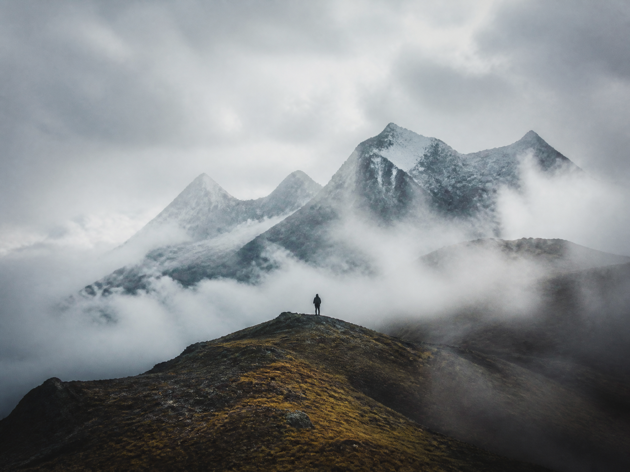 Moody landscape frame from a travel film with fog over mountains