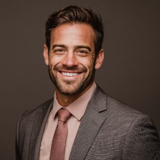 Professional smiling man portrait in suit