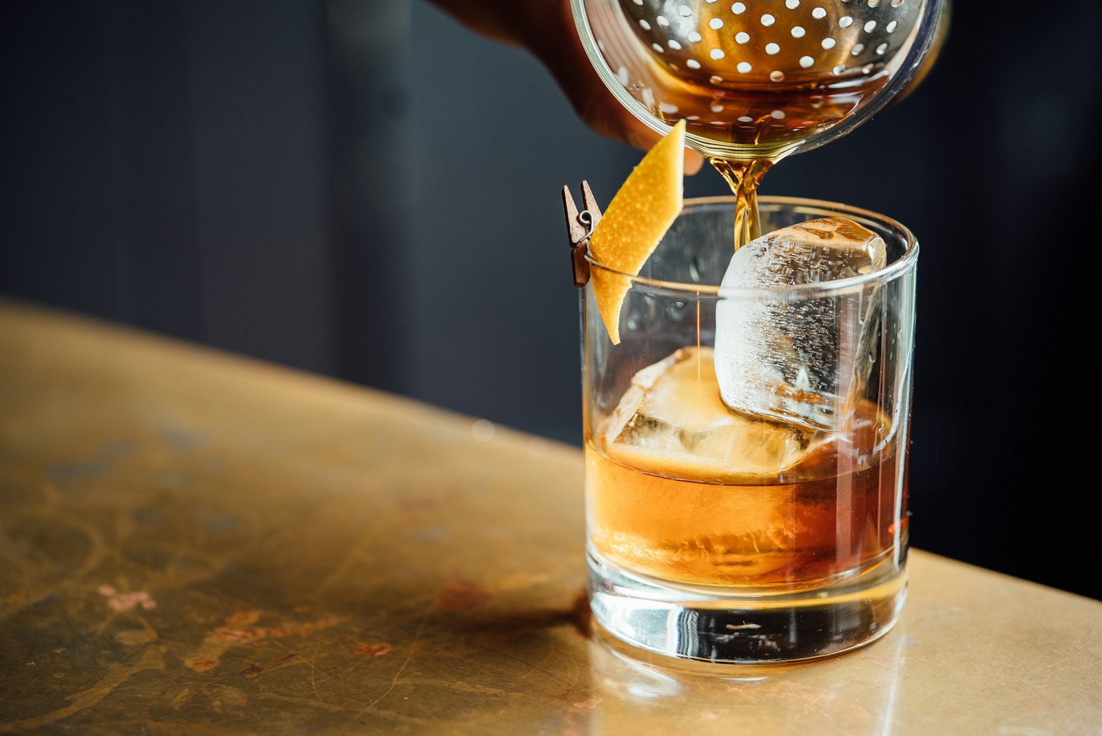 Oak barrel aging warehouse with warm amber lighting